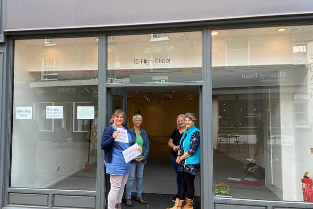 Lisa Hawtin & the Orinoco team putting signs up in their new High Street unit (photo credit Makespace Oxford)