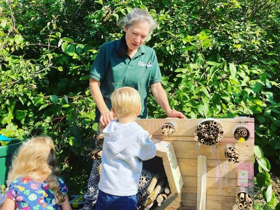 Children work on a bee hotel at an event held at the Bridge Street Garden in Banbury on Saturday September 18. (submitted photo)