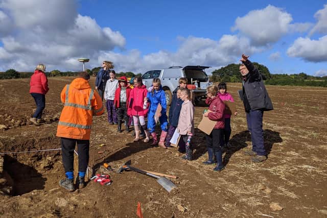 Time Team's expert landscape archeologist, Stewart Ainsworth, explains to Bishop Carpenter Primary School pupils the process of finding the ruins of the Roman villa and how artefacts are collected