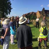 Church groundskeeper Trevor Shepherd gives locals a tour of the green spaces at St Marys churchyard as part of the Meadow to Mill walk during Bloxham's Great Big Green Week