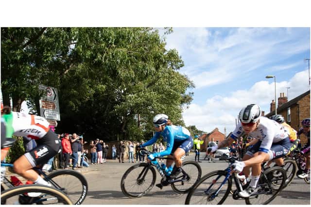 Cyclists come through the village of Deddington in the 2021 AJ Bell Women's Tour cycle race ​(photo by Tom Randall)