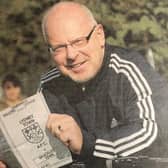 Former Brackley Town FC Saints player Ronnie Johnson holds with the match programme for Saturday 26th September 1981