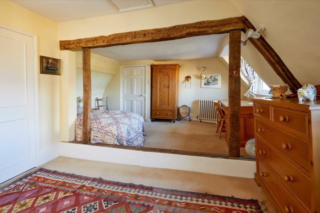 The town house property features eight bedrooms in total and four bathrooms.