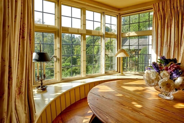 A large bay window overlooks a southerly aspect out over the garden.