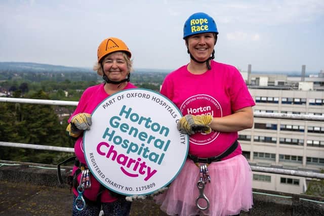 Pippa Parnell, left, and Anna Brain after their brave, fundraising abseil from the roof of the JR hospital. Picture by Joe Baker / Oxford Hospitals Charity
