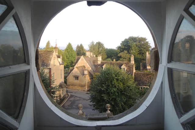 The magic of the Cotswolds is captured here by simply peering through a porthole-shaped bedroom window at HF Holidays' Harrington House in the centre of Bourton-on-the-Water