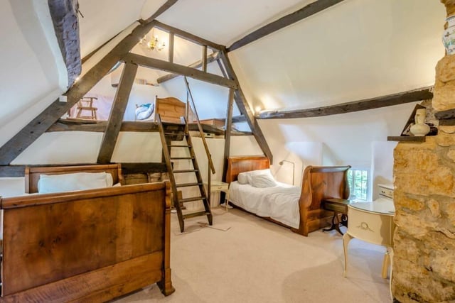 The lower part of the principal bedroom would be used as the main part with a wooden ladder that goes up through an exposed cruck to the open-plan mezzanine room above.