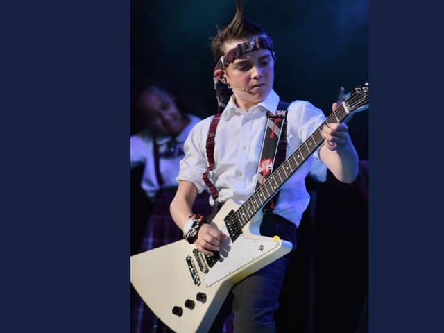 Hanley Webb on stage as Zack, the lead guitarist in School of Rock - The Musical