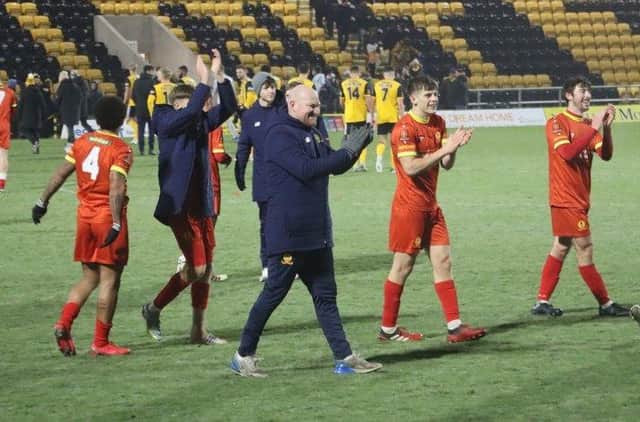 Andy Whing and his players salute the travelling fans after Banbury's fine win at Boston United. Picture courtesy of Banbury United FC
