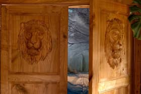 The magical, hand-carved, oak wardrobe doors featuring Aslan lead guests through to an adjoining cottage. Picture by Andrew Ogilvy