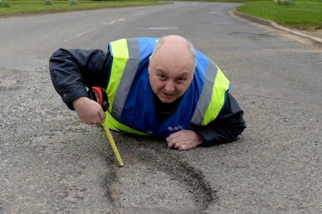Potholes cost motorists £1,000 a year - other road-users risk injury ...