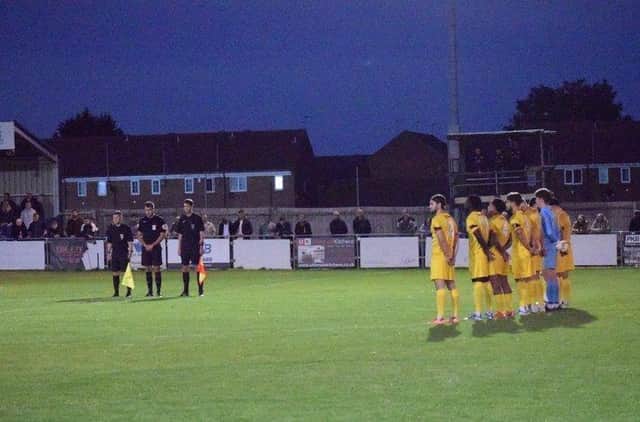 The Banbury United players paid their respects to Her Majesty Queen Elizabeth II ahead of their 3-2 defeat at Peterborough Sports. Picture by Julie Hawkins