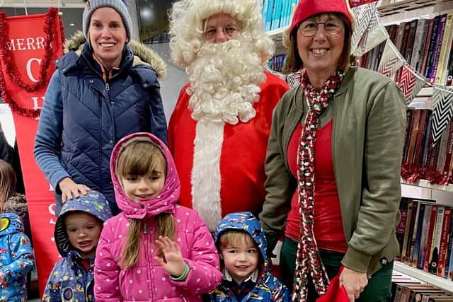 Father Christmas entertaining visitors to the library turned grotto at the Shotteswell Village Hall.