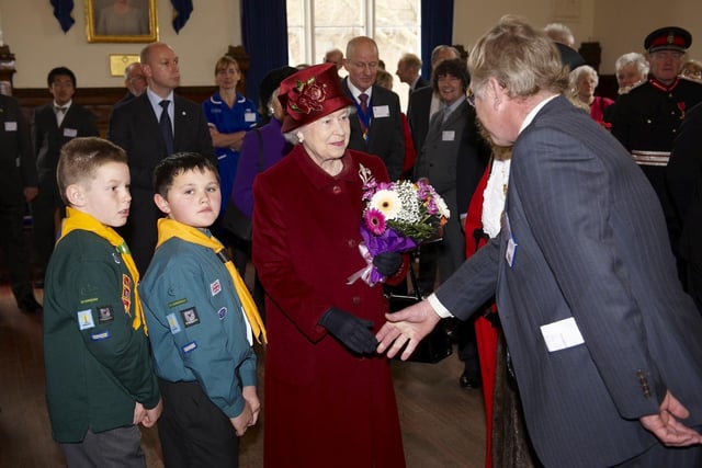 The Queen meets Councillor John Colegrave at the town hall.