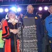 Cllr Jayne Strangwood on stage alongside players and officials of Banbury United FC.