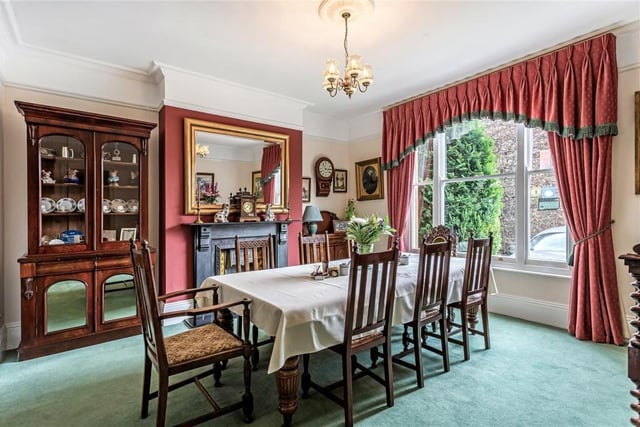 The property features extravagant architectural design including decorative roof detailing, sliding sash and canted bay windows, tall ceilings and well-proportioned rooms.