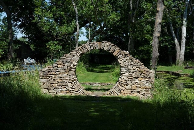 There are woodland walks through the gardens with a folly, living arches, wild flower meadows and special features.