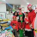 Prabhu Natarajan his wife Shilpa and their Christmas helpers at the Santa's grotto last December.