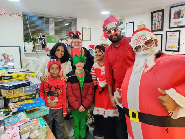 Prabhu Natarajan his wife Shilpa and their Christmas helpers at the Santa's grotto last December.