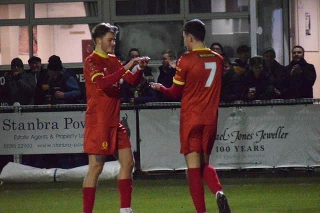 Henry Landers takes the congratulations after scoring one of his two goals in Banbury's win over Coalville. Picture by Julie Hawkins