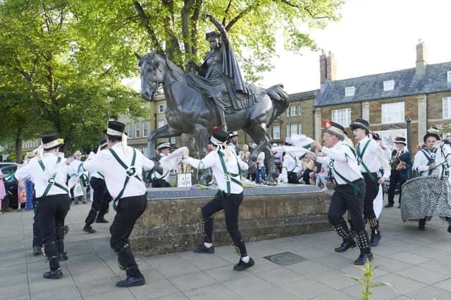 Adderbury Village Morris Men dancing around the statue on Wednesday, April 30.
