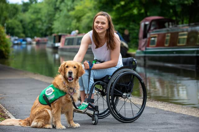Isabelle Atkins with her assistance dog Rumba.