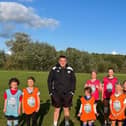 Everyone Active coach Richard Bell with some of the Shipston Wildcat girls’ football players.