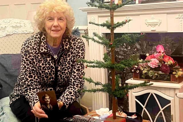 Shirley Hall and her mother's sixpenny Christmas tree which went under the hammer for £3,400 last Friday