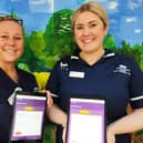 Katharine House Hospice deputy sister Tammy Smith and inpatient unit ward manager Abbie Hessey showing off the new iPads.