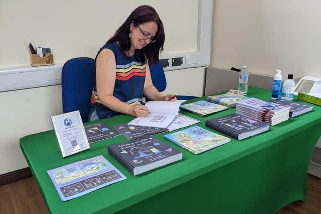 Holly Marlow signing books
