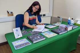 Holly Marlow signing books