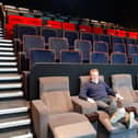 James Morris, CEO of The Light cinema, sits in one of the recliner seats inside one of seven cinema screens set to open on Friday May 27