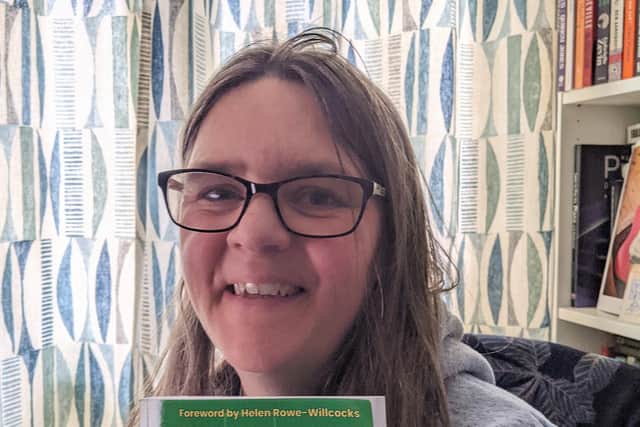 Clare McEwen with a copy of her new book, "She Can Kick It" on publication day.