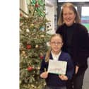 Christmas card competition winner Kate Starkey with MP Victoria Prentis.