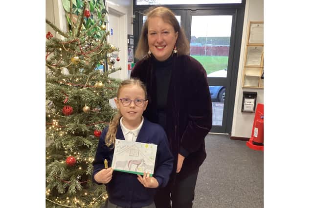 Christmas card competition winner Kate Starkey with MP Victoria Prentis.