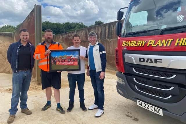 Banbury United ambassador Mark Allitt and commercial liaison assistant Warren Bartlett present Owen Wise and Nathan Matthews of Banbury Plant & Skip Hire with a picture of last season's Southern League champions