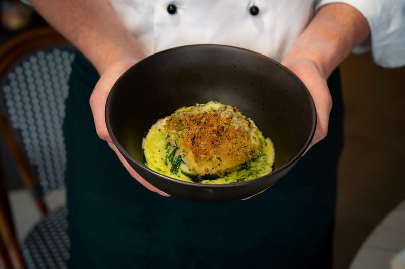 Herb crusted Cornish hake, served with pommes puree, samphire and a parsley oil split beurre blanc