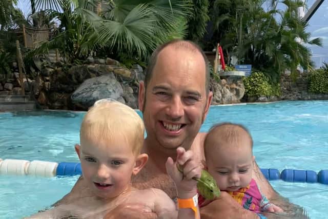Jamie Boswell with water baby son Ollie and daughter Lily in the pool in Majorca