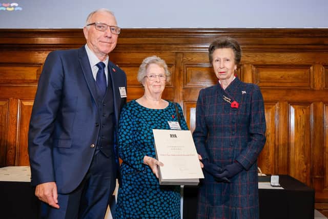 Dedicated volunteers Andy and Myrtle Darby receive their award from HRH The Princess Royal, President of the RYA.