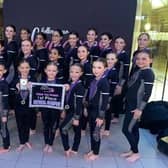 Dancers from The School for Stars Slay Official team with their first place award.