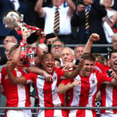 Glenn Walker pictured in the thick of the celebrations when Brackley Town won the FA Trophy in 2018