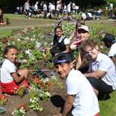 More than 300 boys and girls from 13 schools came together for the town council's planting day this year.