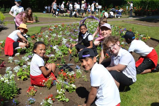 More than 300 boys and girls from 13 schools came together for the town council's planting day this year.