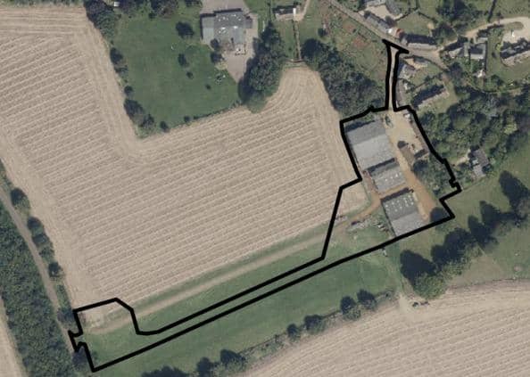 An areal view of Laurels Farm as it is with the outline of the proposed development site area
