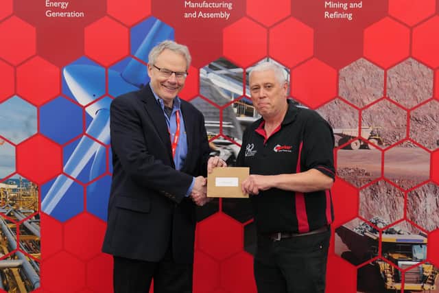 Managing Director of Norbar Torque Tools John Renertson presented employee Shaun Chaundry with a voucher in recognition of 45 years of service.