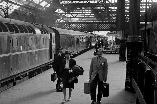 Holidaymakers arrive at Waverley Station in July 1965.