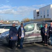 Caryl Billingham, left, is pictured with and hospital staff and trustees outside Brackley Community Hospital with the new patient transport car
