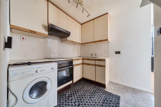 The apartment has a kitchen with space for white goods.