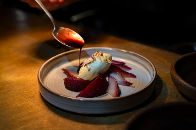 Red wine poached pear infused with Christmas spices and served with a vanilla Chantilly cream