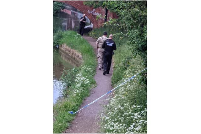 Police and Army bomb disposal officers walk the canal path in Banbury near the site of the discovery of an old grenade on Sunday May 15 (photo from Shane Phillips)